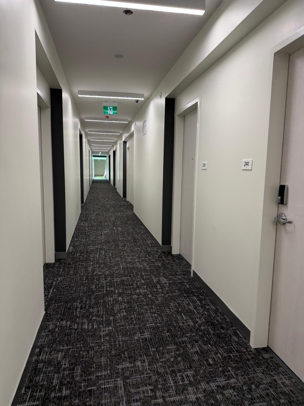 Finished corridor lined with suite doors